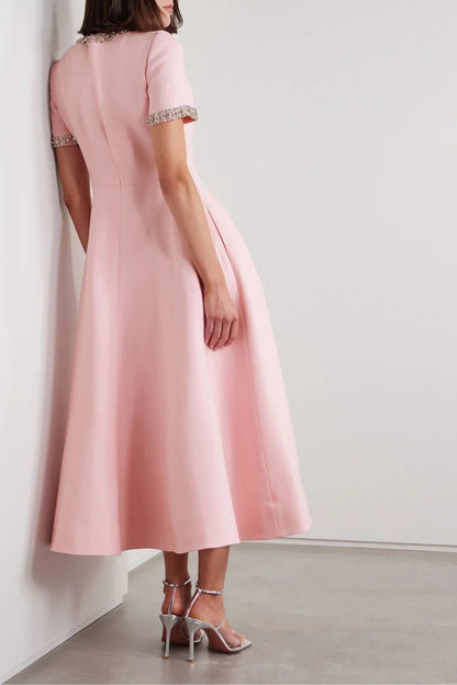 Zoe | Vestido midi con lazo y adornos de cristal